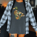 Mallard Duck DTF Heat Transfer, image of a graphic of a duck with patchwork design on a dark t-shirt worn by a person.