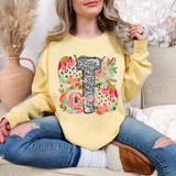 Leopard Floral Easter Occupation DTF Heat Transfer, a colorful floral and leopard print design with the letter T and the word teacher on a yellow sweatshirt.