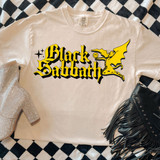 Sixties Band Tee DTF Heat Transfer, a white T-shirt featuring a Black Sabbath graphic design with a yellow demon and smiley face, laid on a black and white checkered surface with accessories.