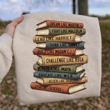 Dream Like Martin, Fight Like Malcolm Book Stack DTF Heat Transfer, illustration of a stack of colorful books with motivational phrases on the pages.