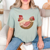 Faux Patchwork Cottagecore Chicken DTF Heat Transfer, a fabric patchwork chicken design on a light gray T-shirt.