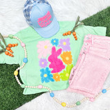 Fluffy bunny and flower chenille patch heat pressed onto a shirt for Easter apparel