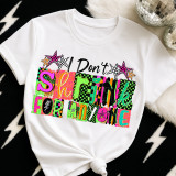 Patterned I Don't Shrink For Anyone DTF Heat Transfer, colorful and patterned design on a white T-shirt with star accents.