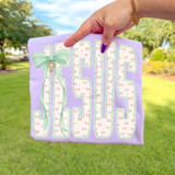 Bow Patterned Jesus DTF Heat Transfer, decorative fabric with a bow and cross design, suitable for crafting and customizing clothing or accessories.