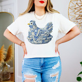 Patchwork Blue Chicken DTF Heat Transfer, a decorative chicken design made from blue patterned fabric patches on a white t-shirt worn by a woman.