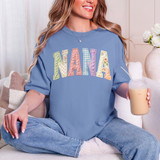 Faux Fabric Patchwork Nana DTF Heat Transfer, colorful patchwork letter design on a blue sweatshirt.