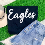 Eagles Fluffy Chenille Patch Transfer, white embroidered eagle logo patch on a black fabric background.