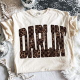 Darlin' Checkered Leopard DTF Heat Transfer, leopard print checkered pattern on the lettering on a white t-shirt.