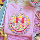 Faux Patch Floral Retro Patch DTF Heat Transfer, pink t-shirt with a colorful embroidered smiley face made of flowers, buttons, and embroidered details.