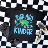 Toad-Ally On To BLUE DTF Heat Transfer, a black T-shirt with a colorful cartoon frog and playful text design.