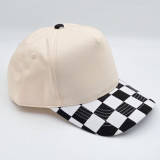 Black & White Cotton Checkered Blank Hats, stylish baseball cap featuring a black and white checkered brim and plain beige crown made of cotton fabric.
