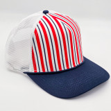 Navy & Red Stripe Structured Cotton Trucker Hat – Fully Adjustable Boutique Blank Cap, featuring a navy brim, white mesh sides, and a red and white striped front panel.