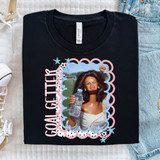 Goal Getter Soccer DTF Heat Transfer, black t-shirt with a custom soccer-themed photo print of a woman holding a water bottle surrounded by decorative sports-themed elements.