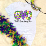 Peace Love King Cake Mardis Gras watercolor Sublimation Transfer, colorful watercolor design of the word 'LOVE' with peace symbol, heart, and cake illustrations on a white T-shirt.
