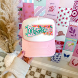 Oklahoma State Pride Bow DTF Heat Transfer, pink and white trucker cap with Oklahoma State design and rainbow colors.