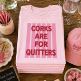 Corks Are For Quitters Puff Screen Print Transfer, pink T-shirt with bold red 3D letters and pink stripes background.