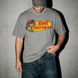 Reel Great Title DTF Heat Transfer, close-up of a person wearing a graphic t-shirt with a fish wearing a cap and the text 'Reel Great Pop Pop' on the front.