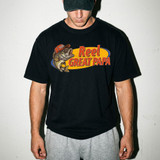 Reel Great Title DTF Heat Transfer, a colorful fish graphic design with text on a man's black t-shirt ready for printing.