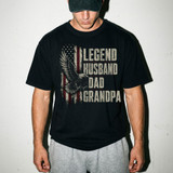 Legend Husband Dad Grandpa Distressed Flag DTF Heat Transfer, a man wearing a black T-shirt with a patriotic eagle and American flag design.