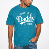 Promoted To Daddy Est 2026 WHITE DTF Heat Transfer, blue T-shirt with white designed text for celebrating a new dad or fatherhood.