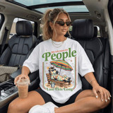 My Tolerance For People Lasts This Long DTF Heat Transfer, a woman wearing a white T-shirt with a colorful cartoon zebra relaxing on a beach chair with an umbrella in a car interior