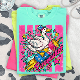 Firequacker Patriotic Goose DTF Heat Transfer, colorful graphic of a cartoon goose wearing a patriotic top hat, riding a rocket with the word 'Firequacker' in vibrant letters, surrounded by stars and explosive effects.