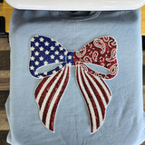 Patriotic Sequin Bow Patch – Americana, a bow-shaped patch decorated with red, white, and blue sequins in stars and stripes pattern.