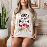 Corks Are For Quitters DTF Heat Transfer, woman modeling a T-shirt with this humorous wine-themed design featuring wine glasses and flowers.