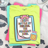 I Don't Bottle My Feelings, My Pharmacy Does DTF Heat Transfer, colorful graphic tee shirt with a medicine bottle illustration and playful text design.
