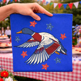 Patriotic Flying Duck DTF Heat Transfer, colorful flying duck design on a blue background with red and blue stars for patriotic themed crafts.