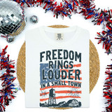 Freedom Rings Louder In A Small Town DTF heat transfer, design on a white t-shirt with patriotic graphic and text about small town life.