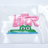 Later Gator Puff Embroidered Hat Patch – 4 x 3 inches, pink and green embroidered patch featuring the word 'LATER' in pink and a green alligator with white eyes on a clear plastic bag
