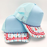 Coastal Fishing Print Blank Trucker Hat, light blue mesh and fabric cap with colorful fishing boat pattern on the brim.