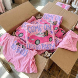 Come On Let's Go Party Brown Hair DTF Heat Transfer, pink graphic T-shirts with a car and a woman illustration for kids' party favors.