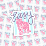 Easy Tiger Vinyl Sticker Sheet, waterproof and weatherproof stickers featuring a pink tiger illustration and the word 'easy' in purple, designed for decorating various surfaces.