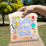 Hello Grade BLUE DTF Heat Transfer, colorful school-themed design with stationery, globe, books, and motivational phrases printed on fabric.