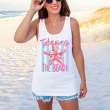 Take Me To The Beach Starfish DTF Heat Transfer, woman wearing a white tank top with a starfish graphic and pink text, on a sandy beach with ocean background.