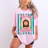 Jesus Saves DTF Heat Transfer, pink T-shirt with graphic of Jesus Christ wearing a crown of thorns and the text 'Jesus Saves' in bold, colorful letters.