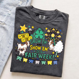 Grow 'Em and Show 'Em It's Fair Week DTF Heat Transfer, colorful carnival-themed design on a dark gray t-shirt with goats, a ferris wheel, popcorn, and tickets.