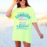 Sunrise Sunburn Sunset Repeat DTF Heat Transfer, a vibrant neon yellow t-shirt with beach-themed graphic and text, worn by a woman at the beach.