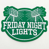 Friday Night Lights Embroidered Hat Patch, green and white cloth patch with embroidered text and design, 4 inches by 3 inches.
