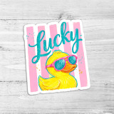 Lucky Rubber Duck Die Cut Vinyl Sticker, cartoon yellow rubber duck wearing pink sunglasses on pink and white striped background.