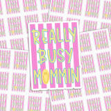 Really Busy Mommin' High-Quality Vinyl Sticker Sheets, colorful stickers with pink and purple stripes, text 'Really Busy Mommin'' with a smiley face, designed for moms with a busy lifestyle