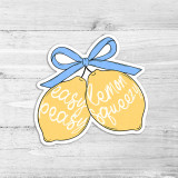 Easy Peasy Lemon Squeezy Die Cut Vinyl Sticker, bright yellow lemons with white script text and a blue bow on top.