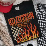 Retro Band Tees - Knockout Black DTF Heat Transfer, black T-shirt with Led Zeppelin band logo and fiery flames graphic.