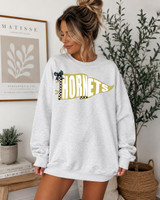 Pennant Teams DTF Heat Transfer, Close-up of a woman wearing a gray sweatshirt featuring a decorative pennant-style design with the word 'HORNETS' in bold letters.