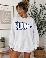 Pennant Teams DTF Heat Transfer, Navy blue and white graphic pennant with the word 'LIONS' on a woman's sweatshirt.