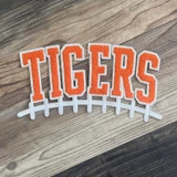 Tigers Orange & White Chenille Football Patch, embroidered patch featuring orange and white tiger lettering with a football lacing design.