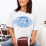 Football Doodle CHOOSE YOUR COLOR DTF Heat Transfer, a woman holding a football with a white T-shirt displaying a blue football themed doodle design.
