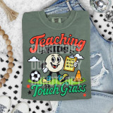 Teaching Kids To Touch Grass DTF Heat Transfer, colorful kiddie t-shirt design with a smiling cartoon ball character, soccer ball, traffic cone, and motivational words.